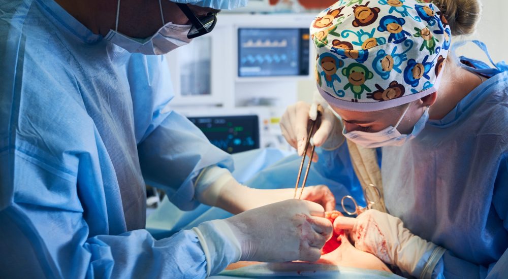 medical-team-doing-abdominoplasty-tummy-tuck-surgery-clinic